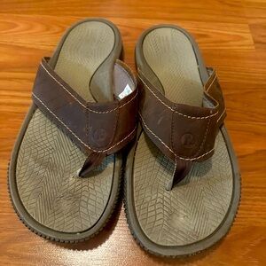 Brown Merrell flip flops. Size 12